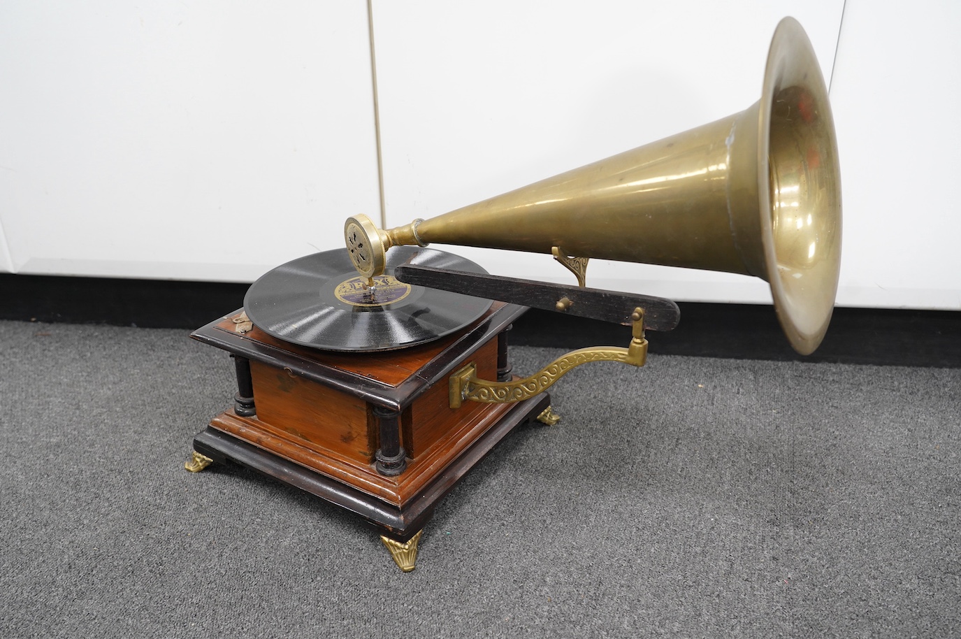 An early 20th century ‘His Masters Voice’ mahogany and ebonised gramophone with brass horn, base 29 x 29cm. Condition - fair